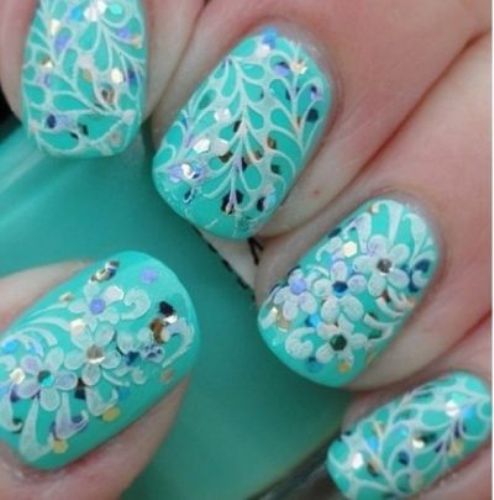 Floral Stamping Patterns Over Turquoise Glitter Nails