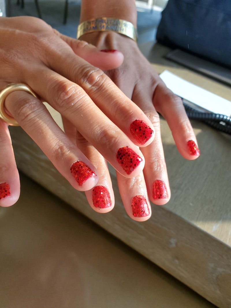 manicure with red polka dot nail polish